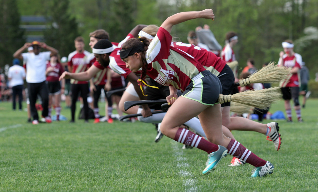 Caption: Getting low on brooms up captures the intensity of the start of every game.